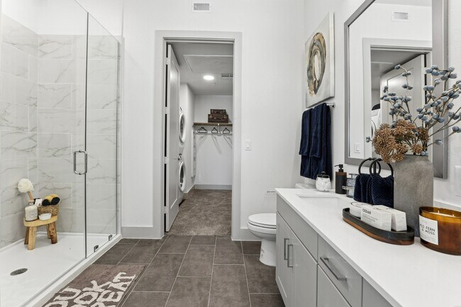 Spa-inspired bathrooms with modern finishes. - The Elmwood