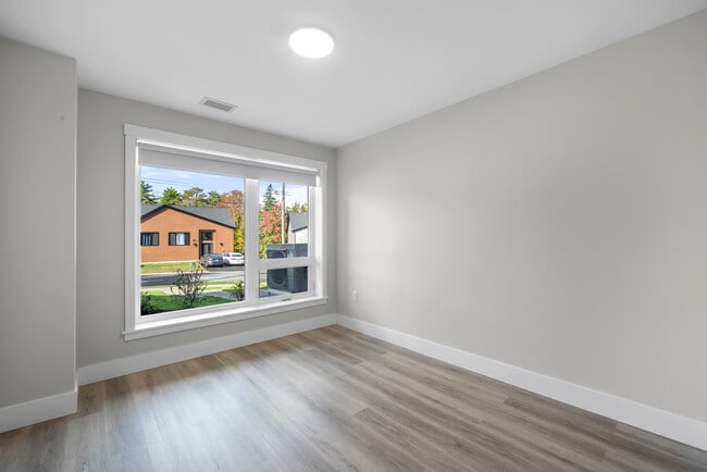 Photo du bâtiment - 1 Bedroom + Den Elation Suites - Plan B1