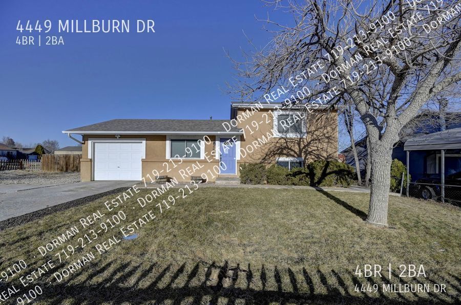 Foto principal - Four bedroom home close to Ft. Carson, Lar...