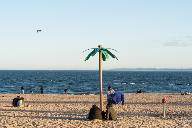 Sunbathe and swim at Coney Island Beach.