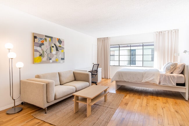 Comfy couch and stylish coffee table - 1637 Cortez St