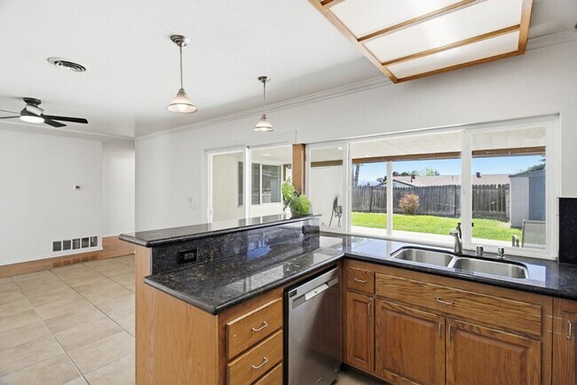 Building Photo - Single level, 4 bedroom, 2 bath home with 2 car garage and RV parking available now!