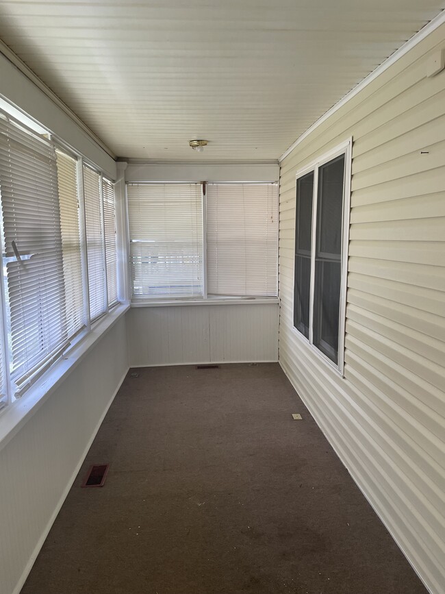 Enclosed front porch - 920 11th St W