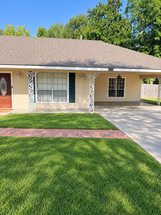 Exterior photo digitally enhanced for lighting and clarity. Property features were not altered - 1875 N Alameda Dr