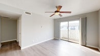 Located at 13450 Esperanza Road in Dallas, TX, this 1-bedroom, 1-bathroom residence offers a thoughtfully designed single-level layout. Light wood-style flooring flows throughout the space, complementing the clean white walls and creating a bright, cohesive aesthetic.

The open-concept main area seamlessly connects the living room, dining room, and kitchen. The living room is airy and well-lit, featuring a ceiling fan and a sliding glass door that opens onto a private balcony with outdoor views. The kitchen is outfitted with stainless steel appliances — including a refrigerator, range, and microwave — white shaker cabinetry, a classic subway tile backsplash, and a generous stone countertop with an undermount sink.

The bedroom is a comfortable, well-proportioned retreat with a ceiling fan, a window that brings in natural light, and access to multiple closets offering ample storage. The bathroom features a full soaking tub and shower combination with white tile surround and chrome fixtures.

Additional highlights include a hallway, a pantry for extra storage, and three closets distributed throughout the unit. The overall ambiance is clean, modern, and move-in ready, making this residence a practical and comfortable home in Dallas.
