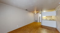 Located at 7100 Shoreline Drive in Stockton, California, this one-bedroom, one-bathroom unit offers a practical and well-organized single-floor layout. The combined living and dining area is finished with warm wood-style flooring and features crown molding, a ceiling fan, and a fireplace with a tiled surround — providing a functional focal point for the room. A large window allows natural light to brighten the space, while a built-in storage closet adds everyday convenience.

The kitchen is efficiently designed in a U-shaped configuration, featuring white cabinetry, stone-patterned countertops, and white appliances including a refrigerator, electric range, and dishwasher. A pass-through area connects the kitchen to the living space, enhancing the open feel.

The bedroom is carpeted for comfort and includes a mirrored sliding-door closet with built-in shelving, complemented by crown molding and a window that brings in natural light. The bathroom offers a single vanity with stone-patterned countertops, white cabinetry, a mirrored medicine cabinet, overhead lighting, and a shower-tub combination. Throughout the unit, consistent finishes and crown molding provide a cohesive aesthetic.