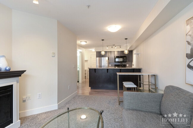 Building Photo - Modern 1 Bedroom + Den Condo with Mountain Views in Prime Abbotsford Location