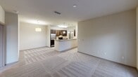 Located at 200 Citygreen Way in Chattanooga, Tennessee, this single-floor residence offers a thoughtfully designed layout with a range of functional and comfortable living spaces. The kitchen is a standout feature, outfitted with dark espresso cabinetry, granite countertops, a classic subway tile backsplash, and a full suite of stainless steel appliances including a refrigerator, range, built-in microwave, and dishwasher. Light tile flooring runs throughout the kitchen, which conveniently connects to a dedicated in-unit laundry room housing a full-size washer and dryer. The bedrooms are generously sized with plush wall-to-wall carpeting, ceiling fans with light fixtures, and large windows that invite natural light. One bedroom provides direct access to a private balcony through glass French doors, while another includes a walk-in closet. The bathroom is well-appointed with a tiled tub-shower combination, dark vanity cabinetry with a granite top, and tile flooring. A carpeted hallway connects the living areas seamlessly, with pendant lighting adding a refined touch. Throughout the unit, neutral tones and clean finishes create a cohesive and move-in ready atmosphere.