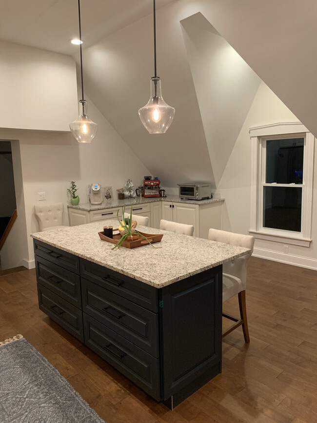 Enormous kitchen island with seating and storage - 168 Island Pond Rd