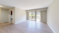 Located at 8501 Walther Blvd in Nottingham, MD, this one-bedroom, one-bathroom residence offers a thoughtfully designed layout with modern updates throughout. The open living room is bright and welcoming, featuring light wood-style flooring, neutral warm-toned walls, and a set of sliding glass doors that lead to a private balcony with outdoor views — allowing natural light to fill the space.

The kitchen has been well-appointed with rich dark wood cabinetry, granite countertops, a subway tile backsplash, a stainless steel sink, and a dishwasher. A window above the counter provides additional natural light, making the kitchen both functional and visually appealing.

The bedroom is a comfortable retreat finished with plush wall-to-wall carpeting, neutral paint, and ample natural light from a window with blinds. A generously sized closet with double doors provides practical storage, while the overall layout offers a quiet and private feel.

The bathroom features a full tub-shower combo with elegant beige tile surround, light wood-style flooring, brushed nickel fixtures and grab bar, and a vanity with a white countertop. Clean, modern, and functional, the bathroom completes this well-rounded residence.