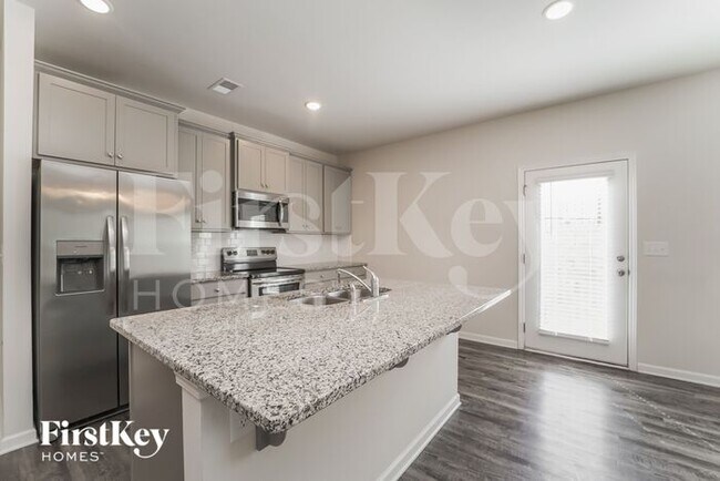 Foto del edificio - 10714 Rivergate Dr NW