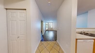 Located at 431 NW 100th Pl in Seattle, WA, this one-bedroom, one-bathroom unit offers a well-organized single-floor layout designed for comfortable, efficient living. The combined kitchen and living room serves as the heart of the space, with rich hardwood-style flooring flowing throughout the main living and bedroom areas. Large windows invite natural light and offer views of surrounding greenery, creating a bright and welcoming atmosphere. A private entrance door with a transom window above adds an appealing architectural touch to the living area.

The kitchen is fully equipped with warm honey-toned wood cabinetry, a double-basin sink, a white electric range, dishwasher, and a full-size refrigerator. Tile flooring and track lighting complete the functional galley-style layout, which connects seamlessly to the rest of the unit via a transitional hallway.

The bedroom is a comfortable, well-proportioned retreat featuring hardwood-style floors, a baseboard heater, and a wide double-door closet providing ample storage. A window allows natural light to brighten the room.

The bathroom features diagonal-set tile flooring, a solid-surface vanity with wood cabinetry, a large mirror, and a tub/shower combination, offering a clean and practical design. A hallway connects all rooms, keeping the layout organized and easy to navigate.