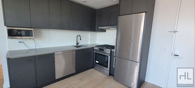 Foto del edificio - Modern 1-Bedroom Apartment with a Balcony!...