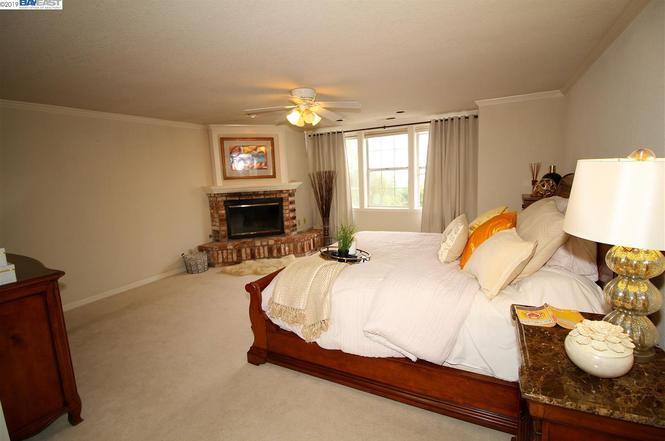 Master bedroom with staged furniture prior to renovations - 1875 Napa Ct
