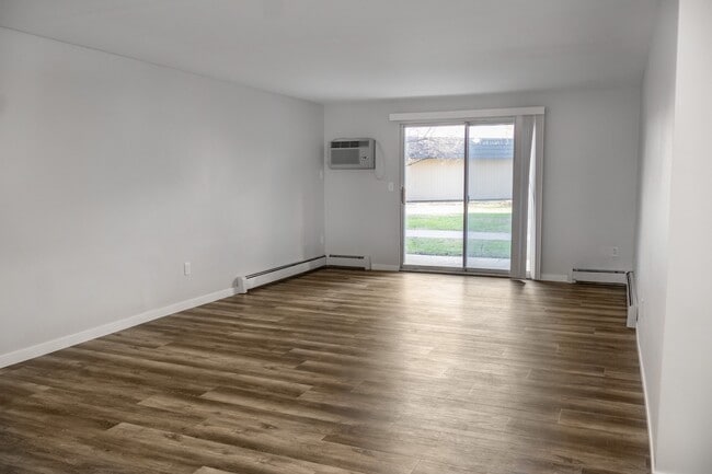 Unveil the spacious elegance of The Gallery with stunning hardwood floors and abundant natural light. This inviting living space seamlessly connects to outdoor tranquility. Ready to elevate your lifestyle? Schedule a tour today! - The Gallery Apartments