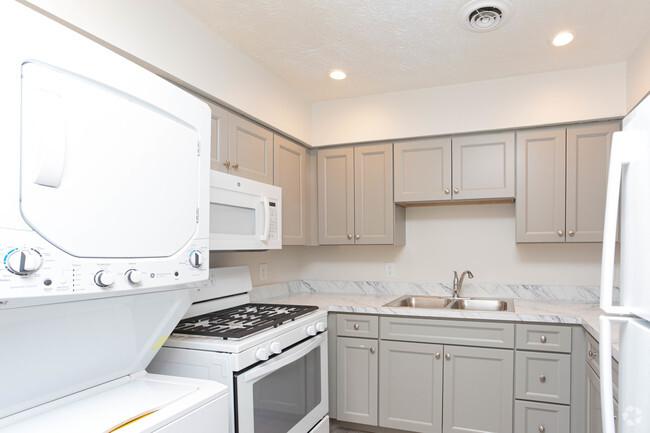 3BR, 1BA - 1,000 SF - Kitchen & Laundry - Covington Place