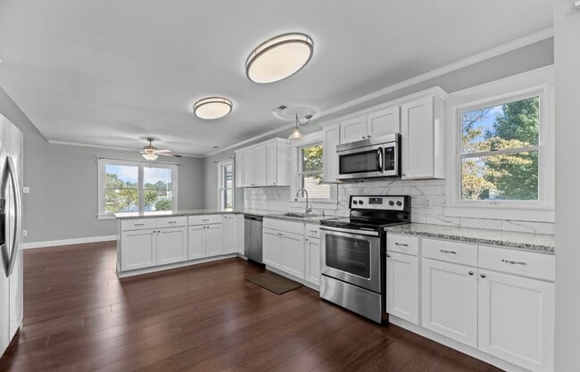 Building Photo - Waterfront Stunner! 3 BR/2 BA + Boat Dock/...