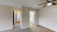 Located at 1305 W Vistula St in Bristol, Indiana, this single-floor residence offers three bedrooms and two bathrooms within a practical, well-organized layout. The living area is carpeted and bright, featuring a sliding glass door that opens to an outdoor view, allowing natural light to fill the space. A ceiling fan adds comfort overhead, while wainscoting detailing adds a touch of character to the walls.

The kitchen is efficiently designed with white cabinetry, a coil electric range, a stainless steel sink, and a full-size refrigerator. Light-toned countertops and vinyl flooring complete the functional workspace.

The generously sized primary bedroom features plush carpeting and benefits from natural light through a window with outdoor views. Additional bedrooms are carpeted and well-proportioned, with one offering direct access to a bathroom. Closets with bi-fold doors provide built-in storage throughout.

The two bathrooms serve the home's needs effectively. One includes a full tub-shower combination with white tile surround, while the second features a wide vanity countertop, a large mirror with lighted fixture, and wood-look flooring. A central hallway connects the bedrooms and bathrooms, creating a logical flow through the home.