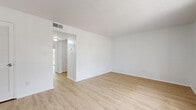 Located at 4606 Forrestal St in Pensacola, Florida, this single-floor, one-bedroom, one-bathroom home offers a clean and functional layout with a bright, neutral aesthetic throughout. Light wood-look flooring and crisp white walls run consistently across every room, creating a cohesive and airy feel.

The living room is a comfortable open space featuring a textured ceiling, a front entry door with an adjacent vertical-blind window treatment that allows natural light to filter in, and a louvered closet door providing convenient storage. A hallway connects the main living area to the rest of the home.

The galley-style kitchen is efficiently designed with white cabinetry, ample upper and lower cabinet storage, a stainless steel sink, a dishwasher, and a gas range, making smart use of the available space.

The bedroom is a well-proportioned room highlighted by a sliding glass door that opens to a view of the fenced backyard, bringing in natural light and outdoor connectivity. The bathroom features a wide vanity with white cabinetry, a large mirror, and a tiled shower area, maintaining the clean, white design palette found throughout the home.

Overall, this Pensacola residence offers a tidy, move-in ready environment with consistent finishes and practical room organization.