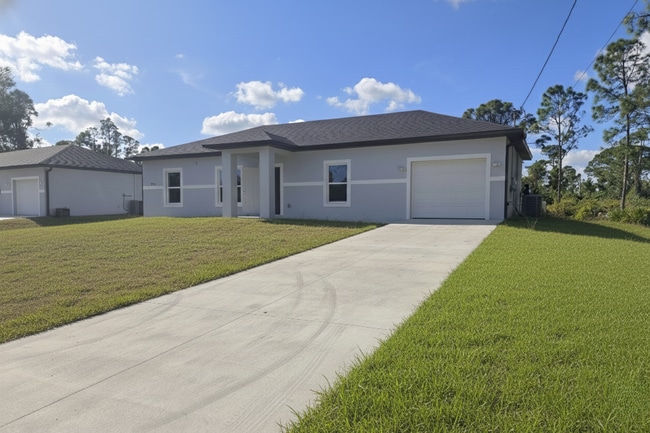 Building Photo - Must SEE- 3/2/1 single family home- South Lehigh Acres