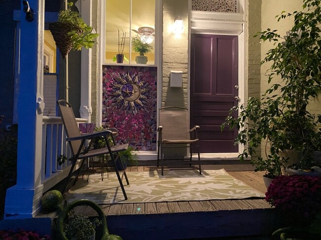 Front porch with mosaic art work. - 5920 Kellogg Ave Apartments
