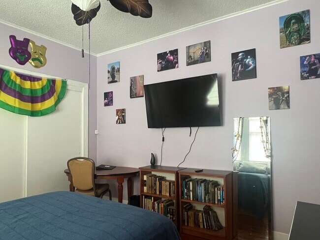 TV and musician photos in bedroom - 2424 Lapeyrouse St