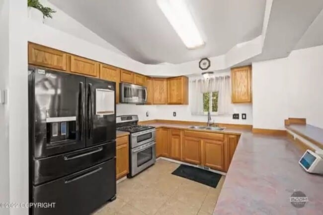 Building Photo - Check out the private fenced backyard!