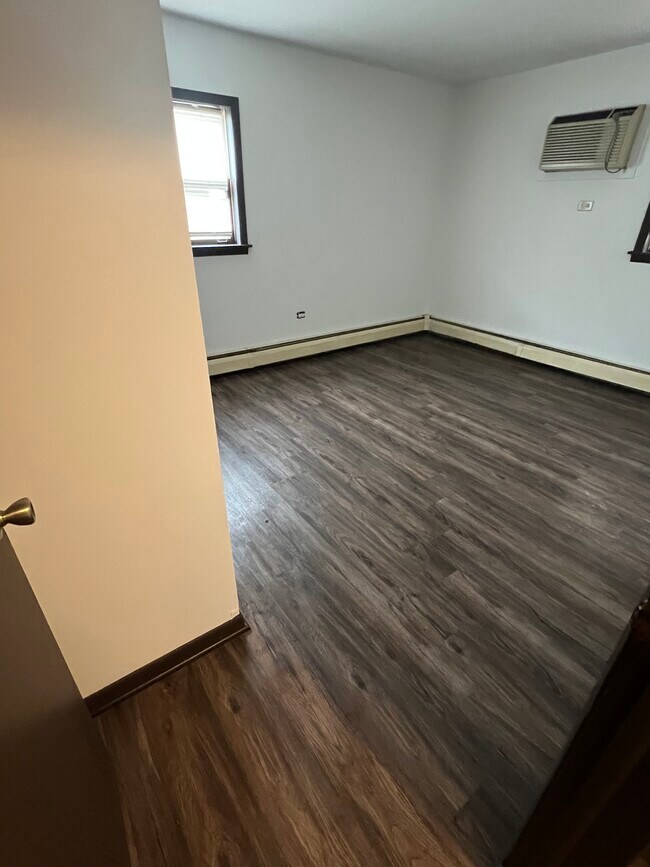 new flooring in bedroom 1 with large closet - 8054 W 95th St