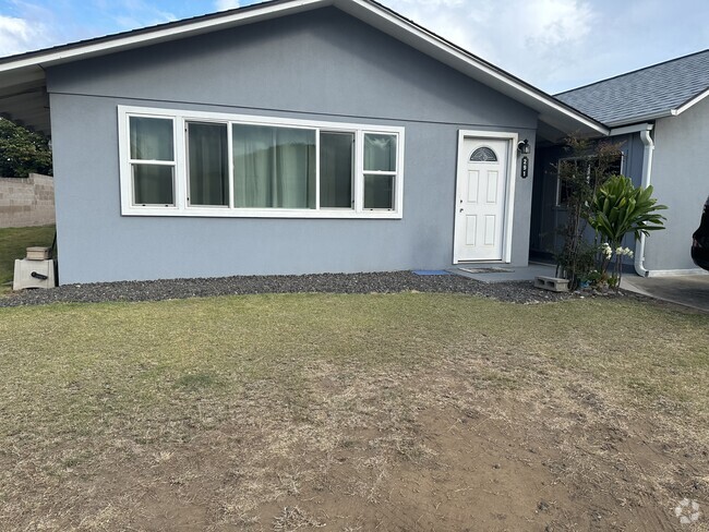 Front of rental. Gravel has been installed for tenant parking in front - 291 W Papa Ave