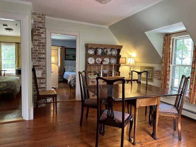 The dining room leads on from the kitchen. Door to Blue Bedroom by the dresser. - 4 Bayview Sq