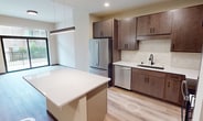 This contemporary 3-bedroom apartment, located at 531 W. Washington in Madison, WI, offers 840 square feet of thoughtfully designed living space. The single-story layout maximizes functionality, with the primary bedroom boasting a generous 240 square feet. 

The apartment features an open-concept design, seamlessly connecting the living areas. Large windows in the bedrooms and living space flood the rooms with natural light, creating an airy ambiance. The kitchen is a focal point, equipped with stainless steel appliances, ample counter space, and modern cabinetry. A central island provides additional workspace and casual dining options.

Throughout the apartment, light-toned hardwood flooring adds warmth and continuity. The bedrooms are well-proportioned, with the primary bedroom offering extra space for comfort. Built-in closets in each room, including a dedicated closet space, ensure ample storage.

The bathroom, while not explicitly detailed, likely continues the modern aesthetic found throughout the apartment. The overall design emphasizes clean lines and neutral tones, creating a versatile canvas for various decorating styles. This apartment combines style and practicality, ideal for those seeking a contemporary urban living experience in Madison.