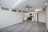 Located at 1704 Hornblend St in San Diego's sought-after Pacific Beach neighborhood, this efficiently designed one-bedroom, one-bathroom unit offers a clean, modern aesthetic throughout its single-floor layout. Light-toned hardwood flooring flows seamlessly across every room, creating a cohesive and airy feel.

The open-concept living, dining, and kitchen area maximizes the available footprint. The kitchen is well-appointed with white shaker-style cabinetry, white subway tile backsplash, light countertops, and a full suite of stainless steel appliances including a refrigerator, electric range, over-the-range microwave, and dishwasher. A wall-mounted mini-split HVAC unit ensures year-round climate comfort. The living area benefits from a bank of large front-facing windows fitted with horizontal blinds, allowing ample natural light while maintaining privacy.

The bedroom is a cozy, well-proportioned space featuring a ceiling fan with integrated lighting and a dedicated closet. High clerestory windows add an architectural touch while bringing in additional natural light.

The bathroom features a white vanity with brushed nickel hardware, a large mirror, and a tiled tub-shower combination, maintaining the clean, neutral palette found throughout the unit.