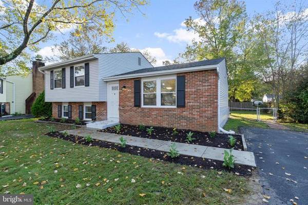 View of the house, driveway, and backyard fence. - 7922 Fitzroy St