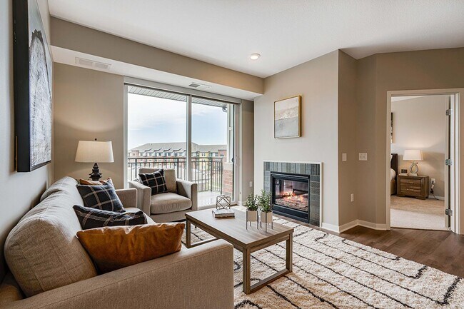 Many homes feature a cozy fireplace in the living room. - Ascend at Woodbury