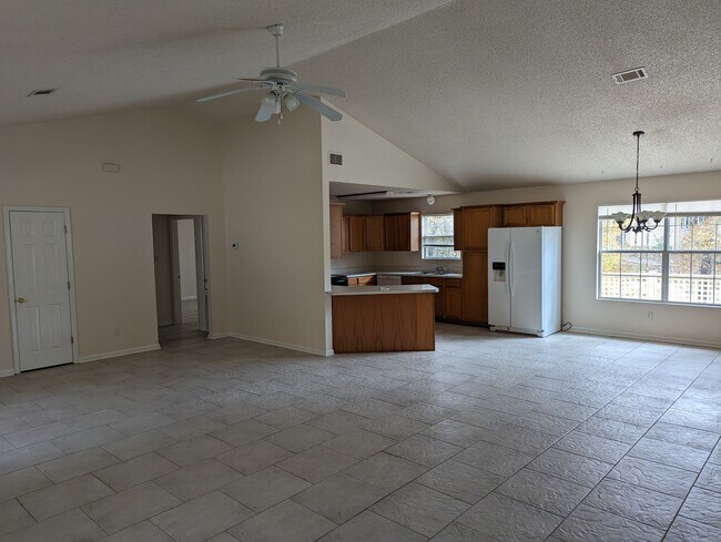 Living room into kitchen - 115 Tam O Shanter Ct
