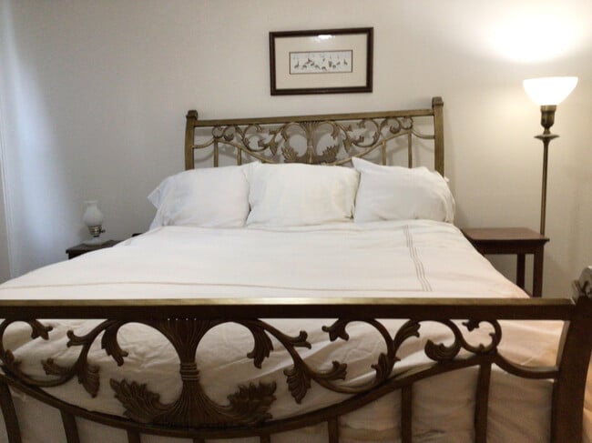 main bedroom brass bed - 919 S Charles St