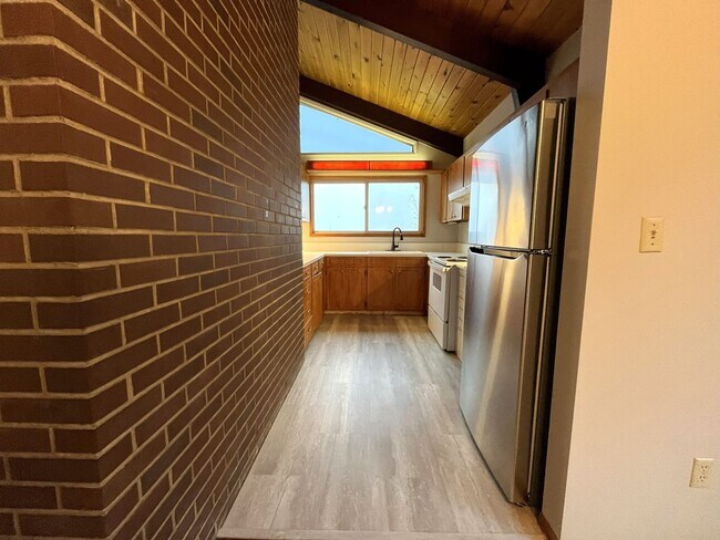 Building Photo - Beautiful Multi-Level Home with Vaulted Ceilings & Stunning Wood Accents