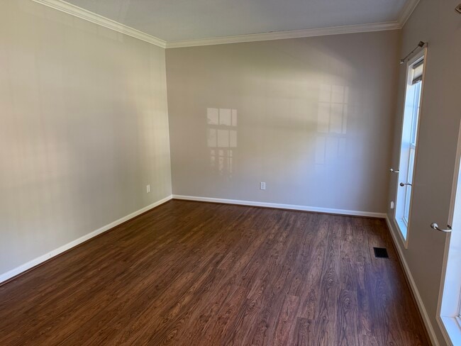 Living Room with front windows that make this room easy for leaving space or office area - 6419 Woodmont Rd