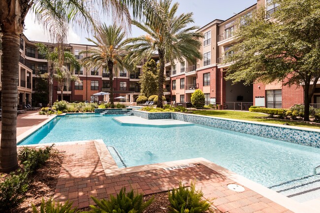 Resort-Inspired Pool with Sun Ledge, Lap Pool, and Waterfall. - The Atlantic Memorial