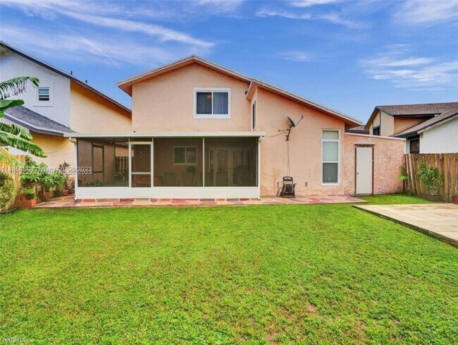 Foto del edificio - 4 br, 3 bath House - 1007 NW 106th Avenue Cir