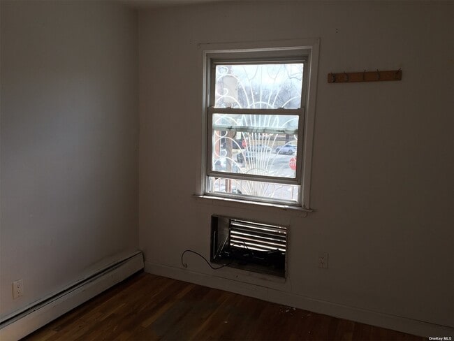 Building Photo - 43-18 Dahlia Ave