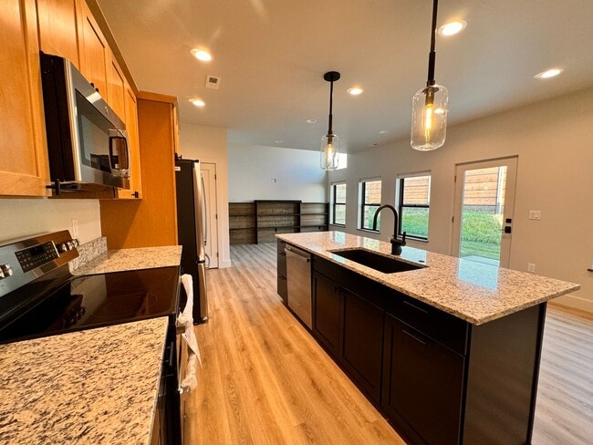 Building Photo - Modern, Spacious 3-Bedroom Townhome in the...