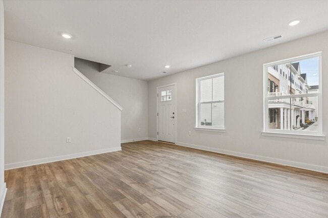 Building Photo - COMING SOON! Brand New River Pointe townhome with modern finishes, flexible living space, and a p...