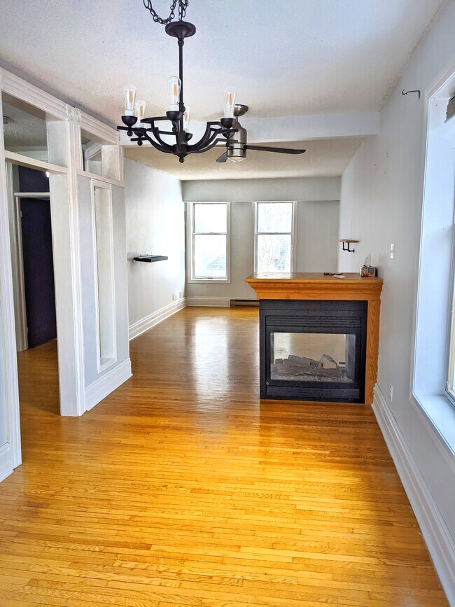 looking from dining area to front room. Gas fireplace. - 737 4th Av E