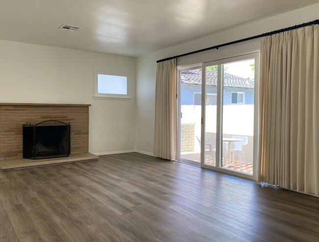 Living Room with Wood Burning Fireplace - 22009 De La Guerra St