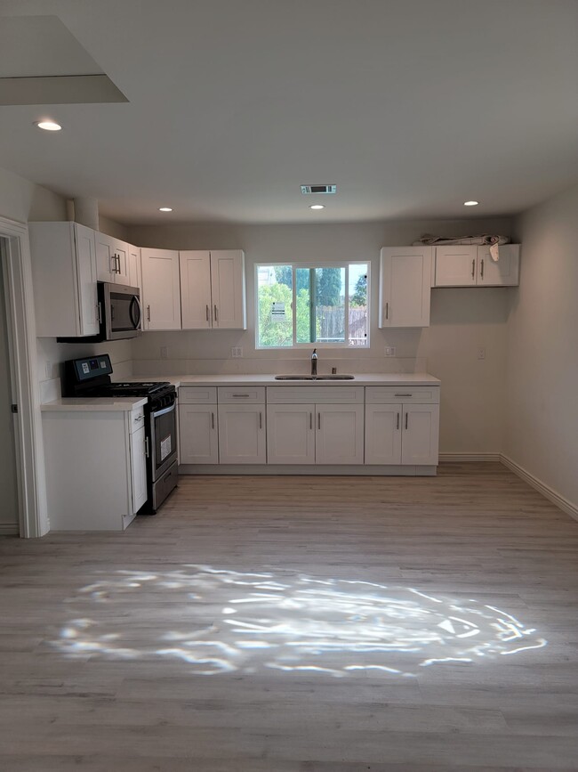 Building Photo - 7618 De Soto Ave
