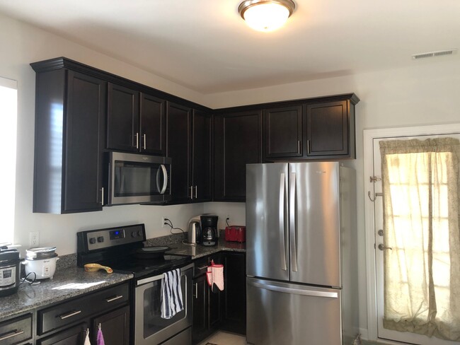 full-size three-door refridge with filtered water fountain - 4325 Candace Ln