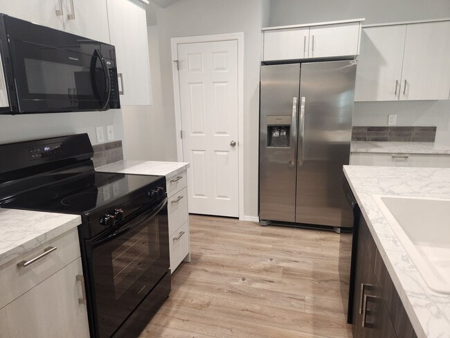 Building Photo - Be the First to Live in This Stunning New ...