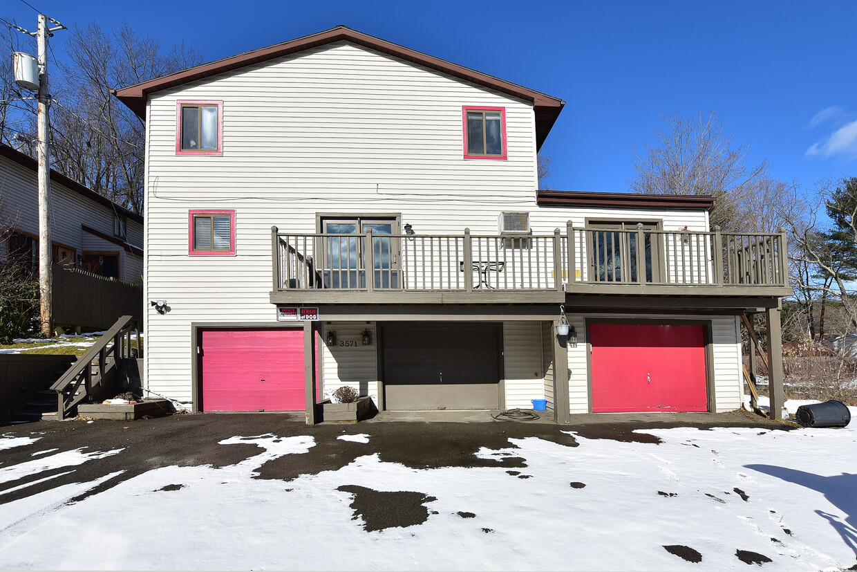 Front of house. Includes middle and right garages. - 3571 Smith Dr