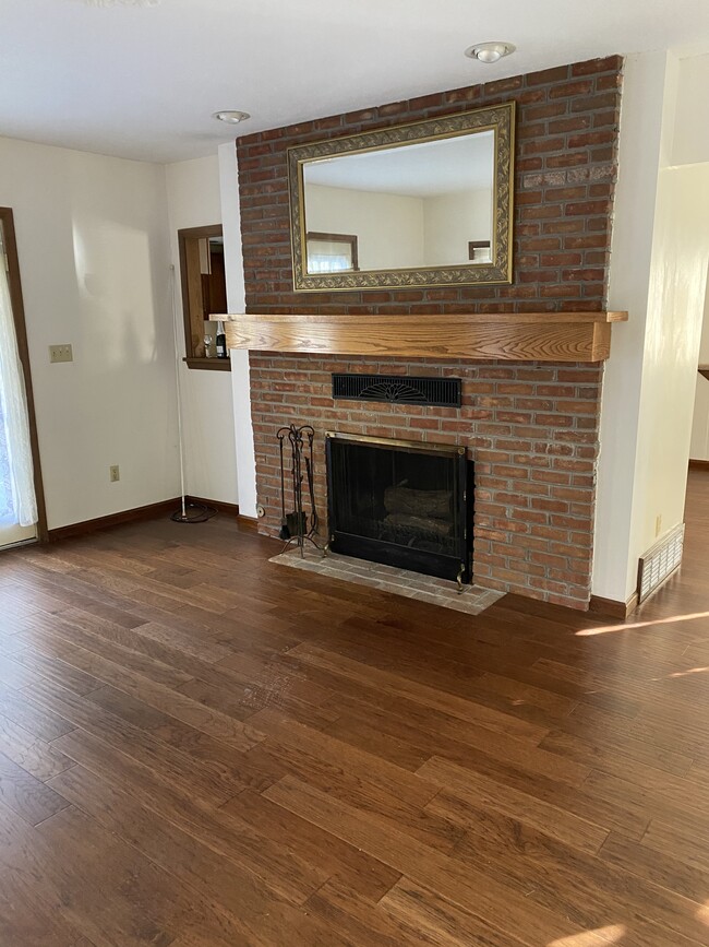 Wood burning fireplace in living room - 128 Hall St